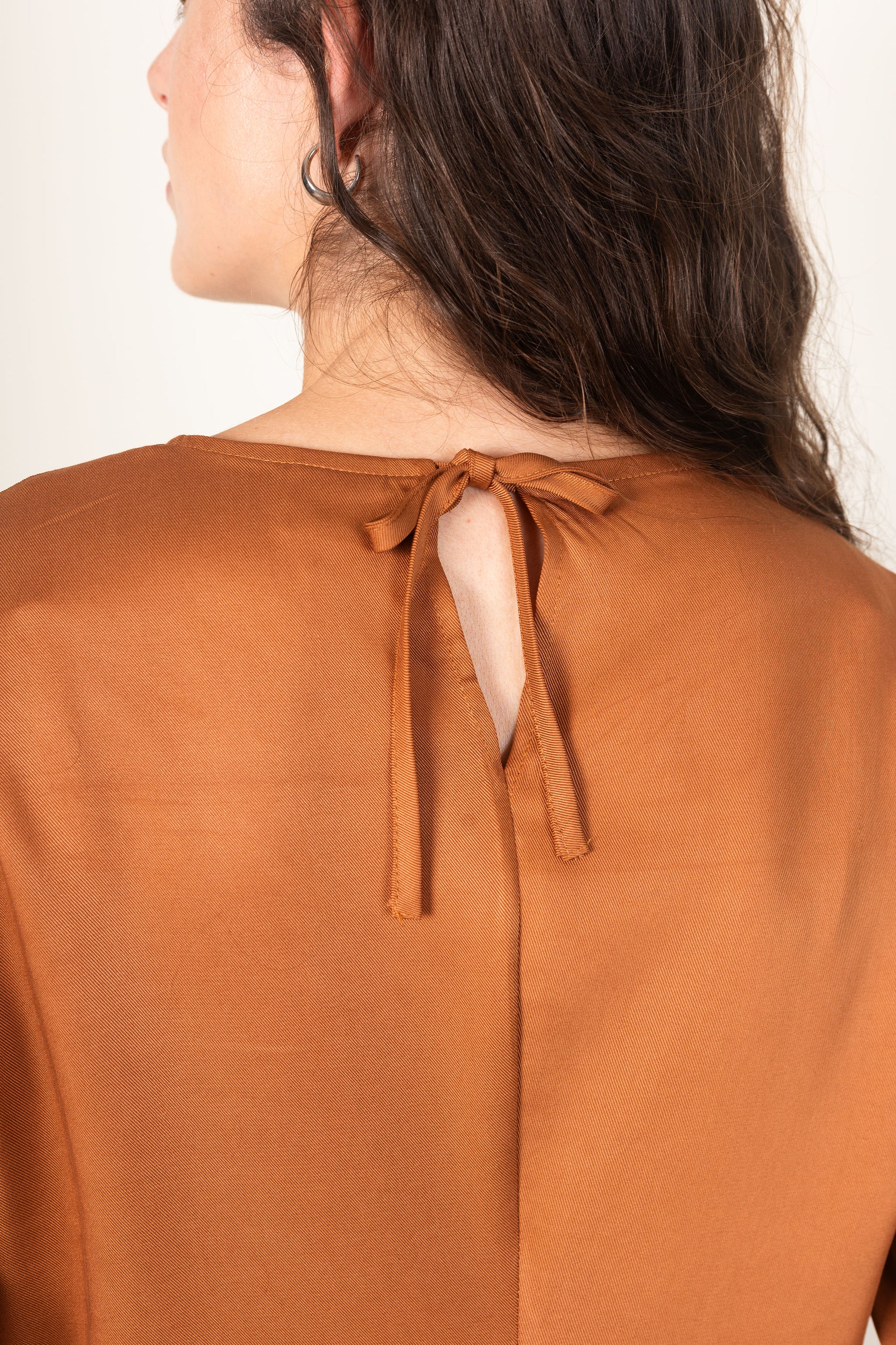 Ames Store Staple Dress in Bronze close up of bow tie back Autumn Winter dress